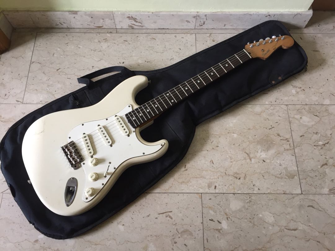squier_japan_stratocaster_by_fender_olympic_white_natural_relic_1520865410_f34941db.jpg