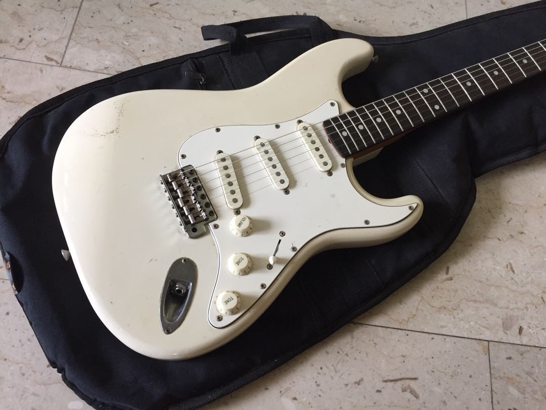 squier_japan_stratocaster_by_fender_olympic_white_natural_relic_1520865411_3a8668de.jpg