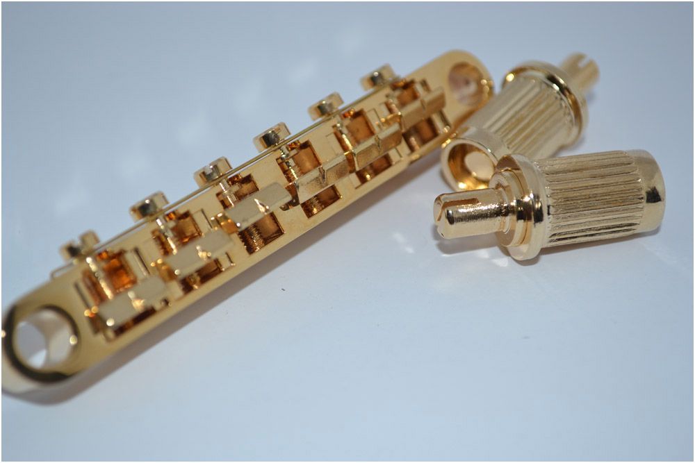 12-string-gold-color-the-tune-o-matic-bridge.jpg