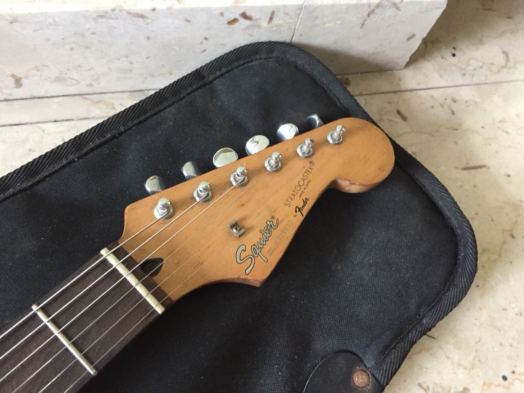 squier_japan_stratocaster_by_fender_olympic_white_natural_relic_1520865411_f8d5ab36.jpg